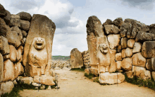 a stone statue of a lion with its mouth open