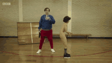 a man in a england shirt is standing on a basketball court with the word whack written on the floor