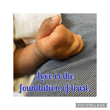 a picture of a baby 's hand with the words love is the foundation of trust above it