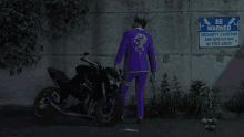 a man in a purple suit stands next to a motorcycle in front of a sign that says be warned