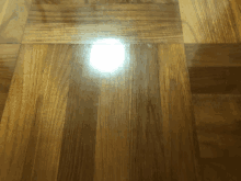 a light shines on a wooden floor