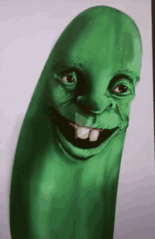 a drawing of a green pickle with a big smile on its face