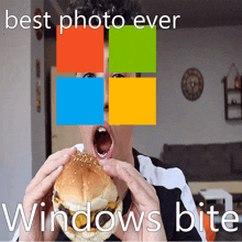 a man eating a hamburger with the microsoft logo on his face