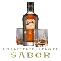 a bottle of rum sits next to two glasses with the words un presente lleno de sabor below it