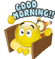 a smiley face is sitting in a bed with an alarm clock and says good morning !