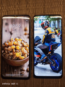 two infinix hot 10s phones on a wooden surface