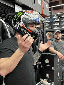 a man wearing a helmet that says monster energy