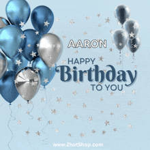 a birthday card with blue and silver balloons and the name aaron