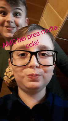 a boy wearing glasses has the words amc bei prea multa cola written across his face