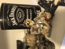 a can of jack daniel 's sits next to a skeleton