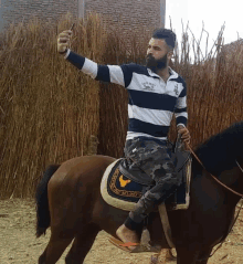 a man riding a horse with a saddle that says eagle