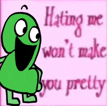 a green cartoon character is standing in front of a pink sign that says `` hating me won 't make you pretty '' .