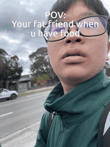 a man wearing glasses and a green jacket with the words pov your fat friend when u have food