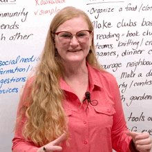 a woman wearing glasses stands in front of a white board that says " organize a food / club "