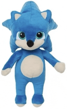 a blue and white stuffed animal with big eyes