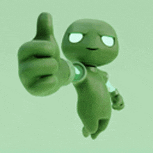 a green alien is giving a thumbs up sign .