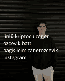 a young man stands in front of a black wall with the words " unlu kriptocu caner " on the top