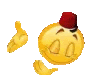 a yellow smiley face with a red hat on its head is giving a thumbs up .