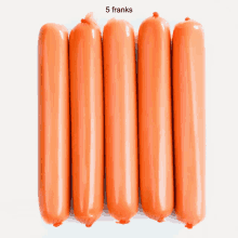 a bunch of hot dogs are lined up in a row with the words 5 franks above them