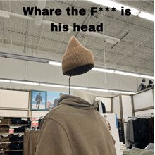 a mannequin with a hat on his head and the words where the f *** is his head