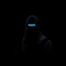 a person in a hood with a blue light coming out of it