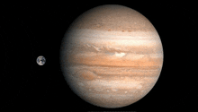 a picture of jupiter and the earth showing the size difference