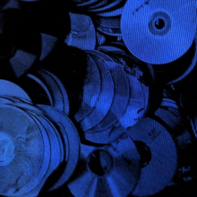 a pile of cd 's including one that says ' love '