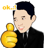 a man in a suit is giving a thumbs up sign