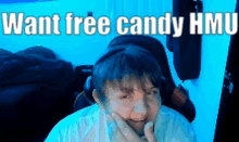 a boy with headphones is smiling with the words want free candy hmu above him