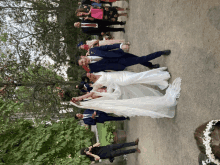 a bride and groom pose for a picture with their guests