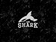 a black and white logo for lee shark with a shark on it