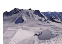 a person is riding a snowboard down a snow covered slope .