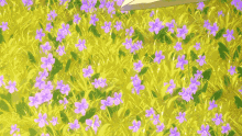 an envelope is laying in a field of flowers