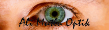 a close up of a woman 's green eye with the words ali mutlu optik written below it