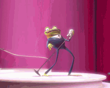 a frog in a tuxedo singing into a microphone on a stage