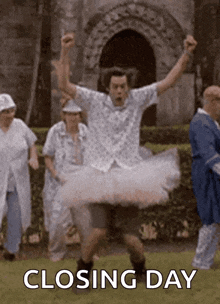 a man in a tutu is dancing in front of a group of people with the words closing day above him