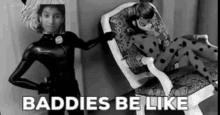 a black and white photo of a ladybug doll standing next to a chair with the words baddies be like .