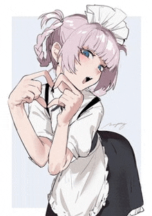 a girl is wearing a maid outfit and making a funny face .