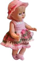 a doll wearing a pink hat and a pink dress