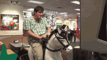 a man is riding a rocking horse in front of a sign that says ' great delicatessen ' on it