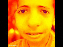 a close up of a child 's face with a red background