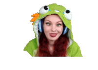 a woman with red hair is wearing a green frog hoodie