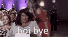 a woman in a red dress is standing next to a woman in a white dress and says boi bye .