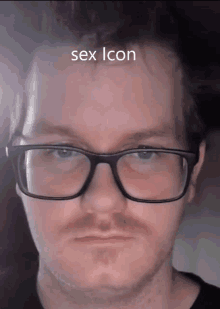 a close up of a man 's face with the words sex icon on the bottom