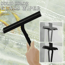 a hand is holding a black glass wiper with the words solid color glass wiper above it