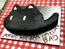 a cake that says meow has been very bad on it