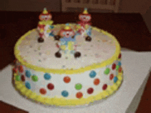 a clown cake with polka dots and yellow frosting