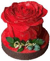 a cake with a red rose and the word love