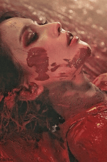 a close up of a woman with blood on her face and the words cold tea below