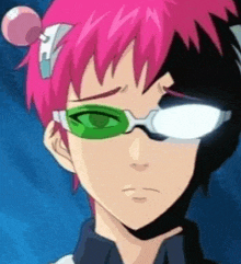 a close up of a person wearing glasses and a pink hair clip .